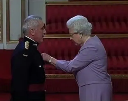 Lt Colonel John Harker MBE receiving his honour